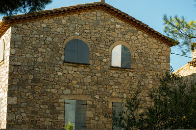 Low angle view of old building against sky