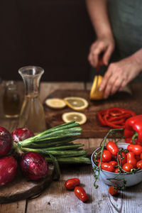 High angle view of strawberries on cutting board on table