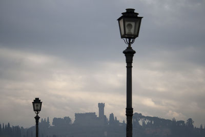 Low angle view of street light against sky