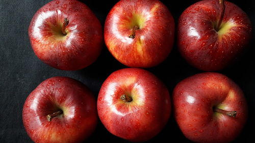 High angle view of apples on black background