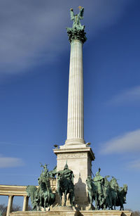 Low angle view of statue against sky