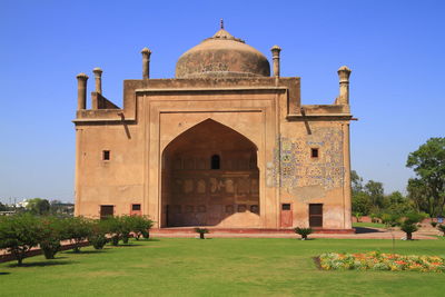 View of historical building against clear blue sky