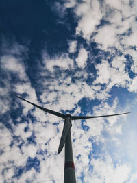 Low angle view of wind turbine against sky