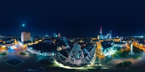 Illuminated buildings in city at night