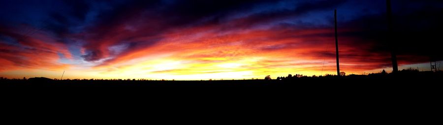 Silhouette of landscape against dramatic sky