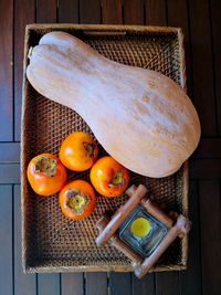 High angle view of fruits in basket on table