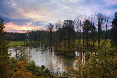 Scenic view of lake against sky during sunset