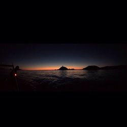 Scenic view of sea against sky at night