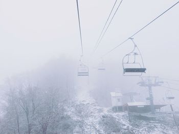 Overhead cable car over sea during winter