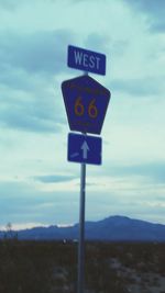 Scenic view of landscape against cloudy sky