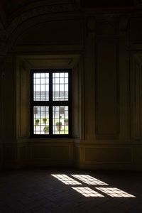 The sunlight coming in through the window and reflecting on the floor