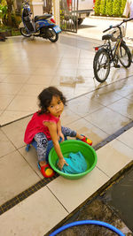 High angle view of woman with umbrella on floor