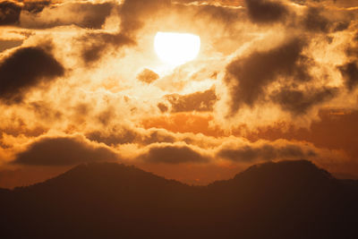 Low angle view of dramatic sky during sunset