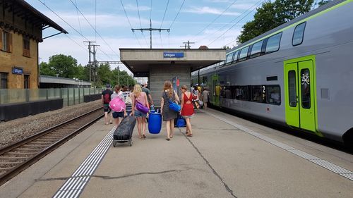 People at railroad station platform