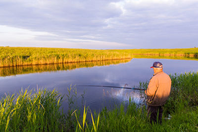 Man fishing in lake