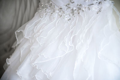Close-up of frills on wedding dress