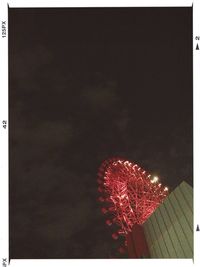 Low angle view of illuminated lights at night