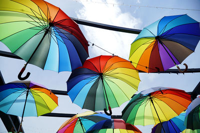 Low angle view of umbrellas against sky