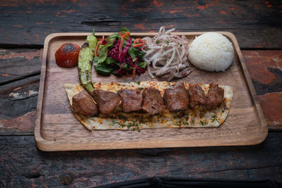 High angle view of meat on barbecue grill