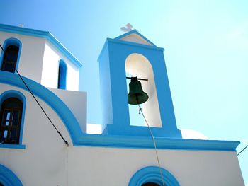 Low angle view of bell tower against clear sky