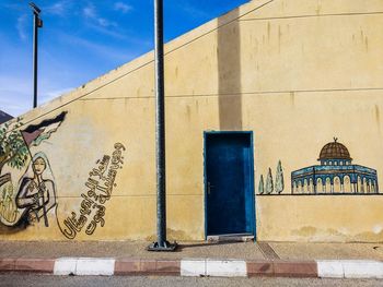 Low angle view of graffiti on wall of building