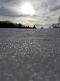 Close-up of water against sky during sunset