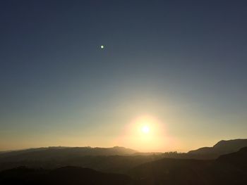 Scenic view of mountains at sunset