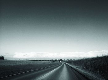 Empty road along landscape