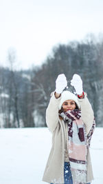 Woman with umbrella in snow