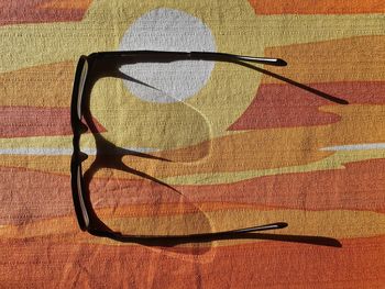 High angle view of sunglasses on table during sunny day