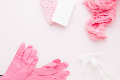 High angle view of pink petals on white background