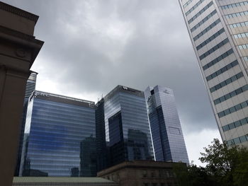 Low angle view of skyscrapers against sky