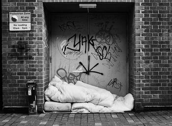Man sleeping on wall