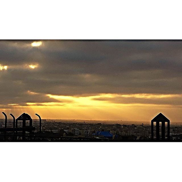 sunset, sea, sky, water, architecture, built structure, horizon over water, scenics, beauty in nature, orange color, railing, tranquil scene, cloud - sky, tranquility, building exterior, nature, beach, idyllic, silhouette, cloud