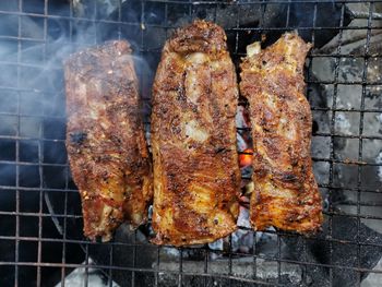 Close-up of meat on barbecue grill