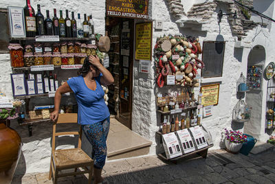 Woman standing at market stall