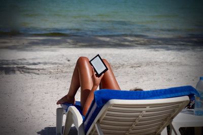 Woman lying on beach