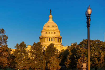 Low angle view of building against clear blue sky