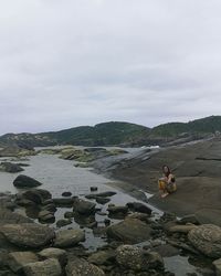 Scenic view of rocks against sky