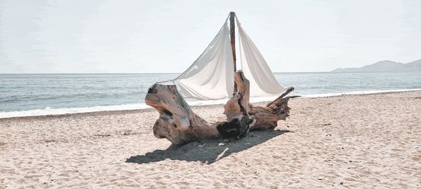 Wooden sculpture on the beach in greece, stavros