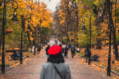 Rear view of woman standing in park