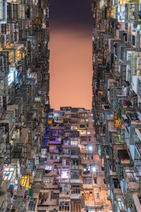 Illuminated cityscape against sky