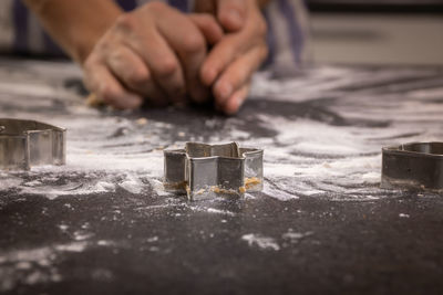 Close-up of hands working on table