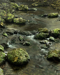 High angle view of river flowing through rocks