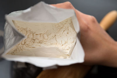 Midsection of woman holding ice cream