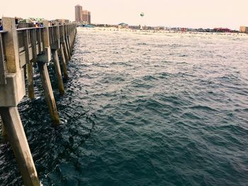 View of built structure by sea