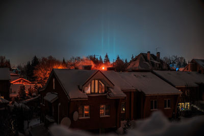 Buildings in city at night