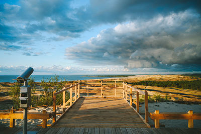 Pier over sea against sky