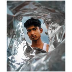 Portrait of young man in water