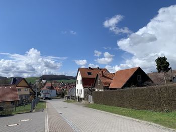 Houses and buildings against sky